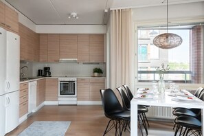 Fully equipped open plan kitchen and dining area.