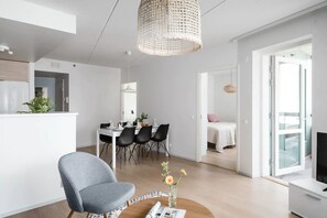 Beautiful open plan dining area and living room with an access to the balcony.