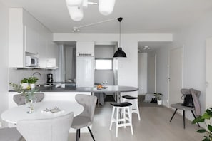 Open plan kitchen, dining area and living room.