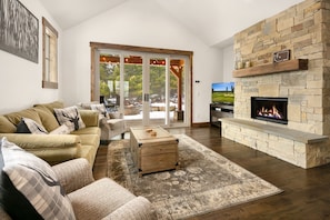 Pine Breeze: - Comfortable couches, gas fireplace, and a large TV.