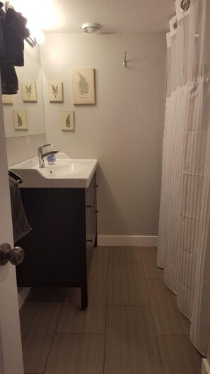 Bathroom with heated floors and a shower tub combo