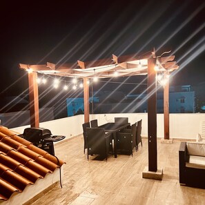 Private roof top terrace after sunset 
