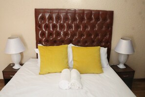 Bedroom with ensuite and queen bed.