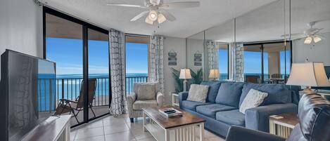 Spacious Living Area with a Sleeper Sofa and Access to the Balcony