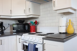 BRAND NEW STOVE, MICROWAVE, UTENSILS, COFFEE MAKER, ETC