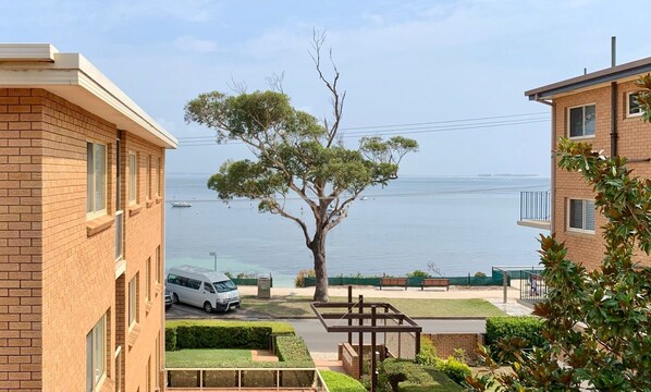 View of Shoal Bay Beach from kitchen, dining area and balcony.