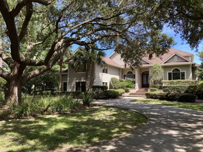 Beautiful Live Oak in front yard. 
Basketball hoop on side driveway.