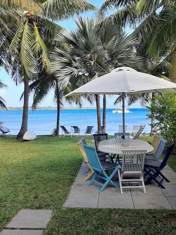 view of front garden and beach from the veranda.
