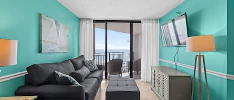 A comfortably furnished unit with a great view of the ocean welcomes you.