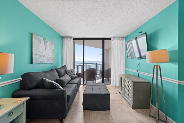 A comfortably furnished unit with a great view of the ocean welcomes you.