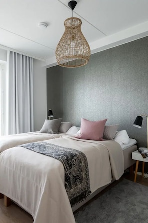 Bedroom 1 with high quality beds and beautiful Nordic decor.