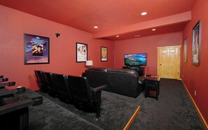 Indoor Theater Room with Plush Couches and Theater Seating