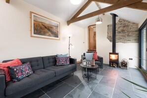 Lounge area with wood-burner at Springfield Linney