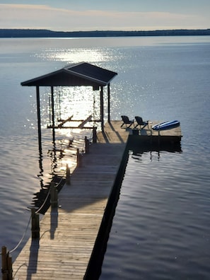 Dock with 2 Adirondack chairs, boat lift