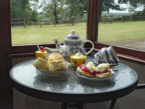 Porch overlooking garden | Penfound Country Cottage, Poundstock, near Bude