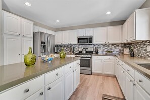 Massive kitchen fully loaded with everything you need. Quartz Countertops.