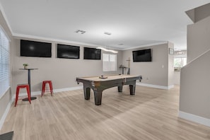 Pool table and FOUR TVs to watch all the sports you want.
