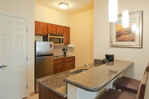 Curb your appetite by cooking a meal in your kitchen.