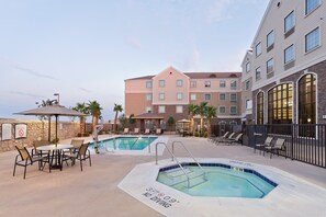 Lounge by the pool in the sunshine.
