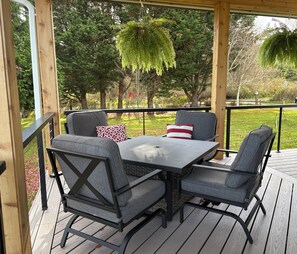 Cuddle into the cushioned chairs for conversation around the table.