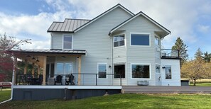 Side view shows the expansive deck; covered for drizzle & uncovered for full sun
