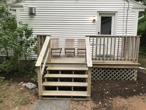 Side porch for relaxing.   Primary entrance 