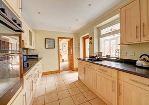 Kitchen with back door to enclosed garden