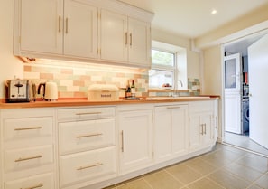 Newly fitted kitchen with access to the utility area