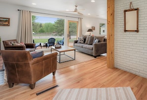 Endless livingroom view that captures the backyard, the park & tennis courts.