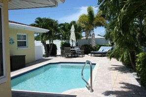 Pool and table seating for 6 along with double chaise. 