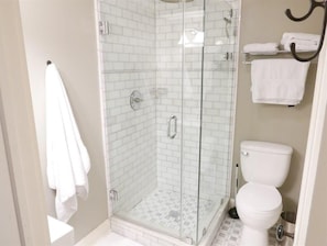 Side angle of the bathroom with rustic brick shower design. 