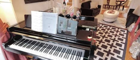 Grand piano welcomes guests into our stunning home