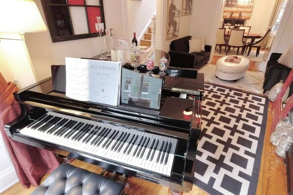 Grand piano welcomes guests into our stunning home
