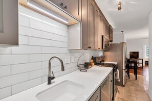 Full kitchen with new stainless steel appliances for all of your cooking.