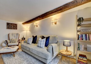 Cosy and comfortable sitting room with woodburning fire