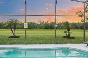 Outdoor pool deck with great sunset views over the state natural preserve, no rear neighbors!