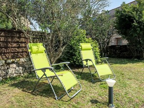 Plant, Furniture, Outdoor Furniture, Chair, Land Lot, Tree, Shade, Armrest, Woody Plant, Leisure