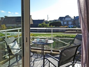 Sky, Table, Plant, Furniture, Building, Window, Chair, Shade, Interior Design