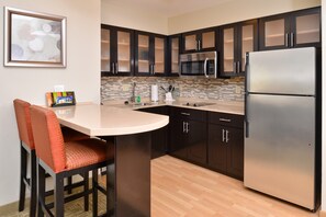 Prepare a meal in the equipped kitchen.