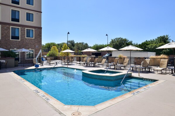 Dive into the outdoor pool on a hot summer day.