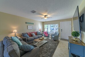 Living room with 65" flat screen; Direct TV, Netflix, etc..