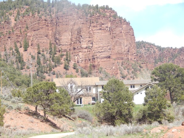 View of house from river. Private dirt road leads to river. 