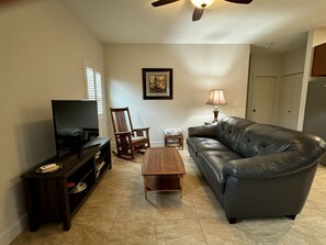 Living room area with leather couch.  