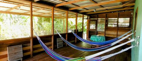 Wrap-around screened deck with 4 hammocks, private dining table & deck seating