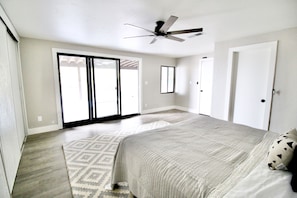 Sliding glass door in Master Bedroom leading out to upstairs covered patio