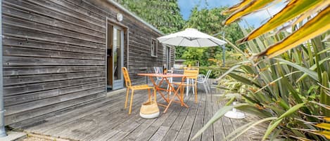 Property, Plant, Sky, Cloud, Building, Shade, Outdoor Furniture, Wood, Umbrella, Tree