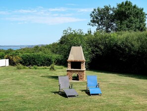 Sky, Plant, Cloud, Natural Landscape, Tree, Table, Land Lot, Outdoor Furniture, Grass, Wood