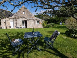 Plant, Sky, Window, Natural Landscape, Chair, Table, Outdoor Furniture, Building, Grass, Tree
