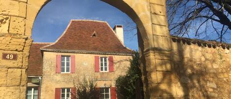 Entrance from small square which is shared with 13th century church. 