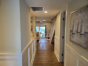 Powder room to the right just off the entry hallway